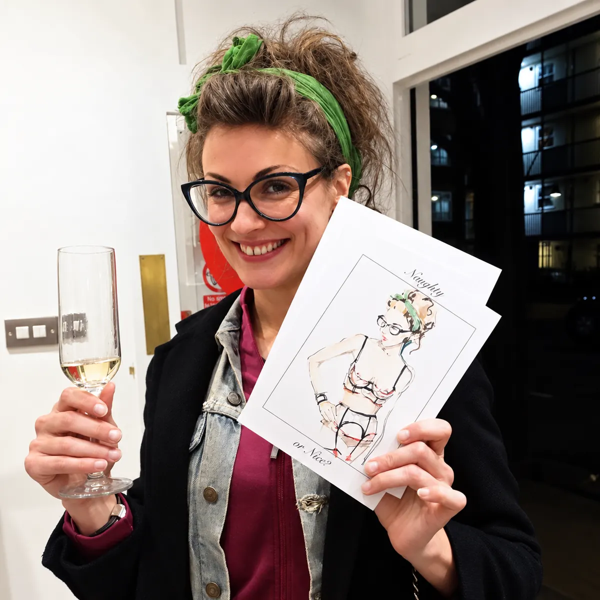 Smiling guest holding her live fashion sketch