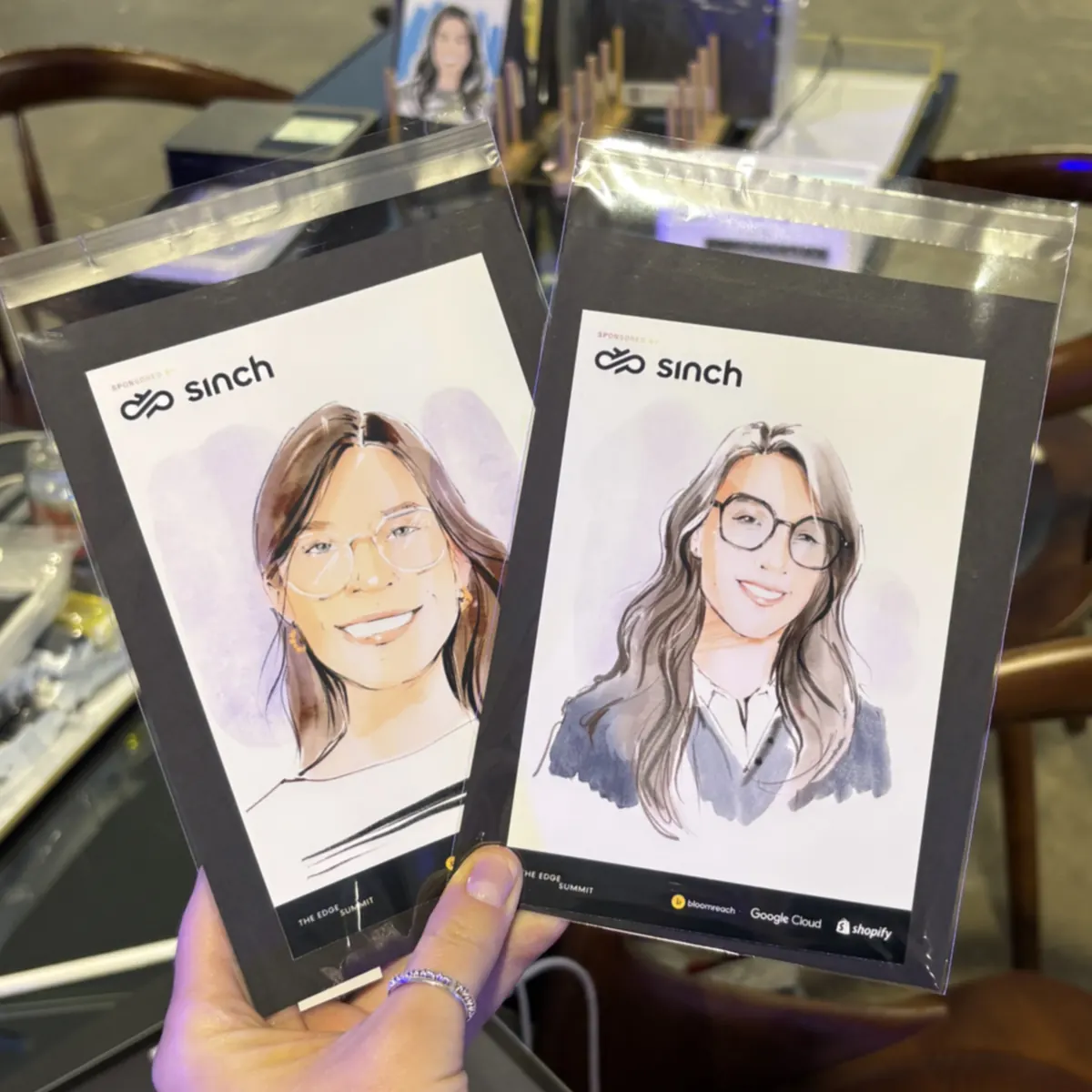 Two guest portraits in branded frames